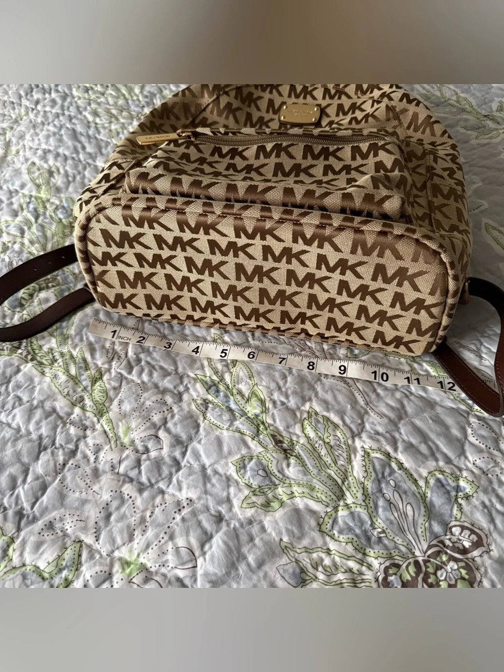 Michael Kors Monogram Logo Backpack with Gold Tone Hardware and Faux Leather Str